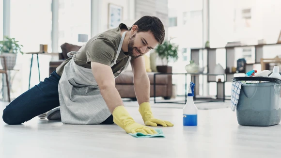 Professional cleaner restoring spotless floors with expert care